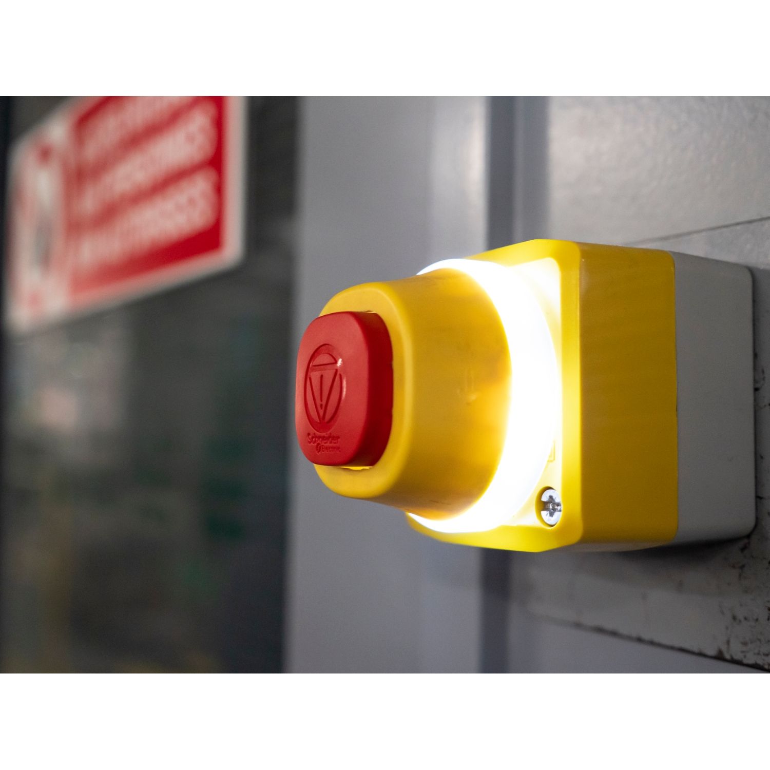Picture of Complete control station, Harmony XALD, XALK, plastic, yellow lid, 1 illuminated emergency stop, white red fixed, turn to release, 1NO 1NC, 24V AC DC
